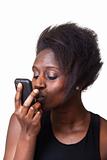 Beautiful Black Woman kissing mobile Phone