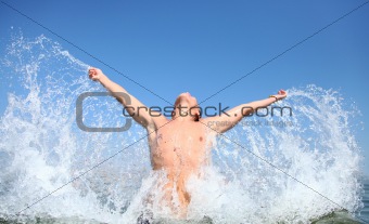 Men splashing on the sea.