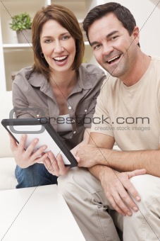 Happy Man & Woman Couple Using Tablet Computer at Home