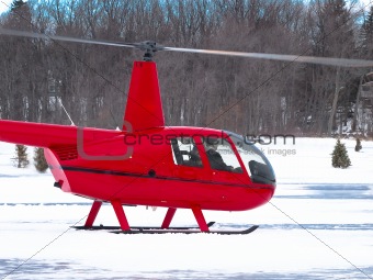 Red helicopter in winter