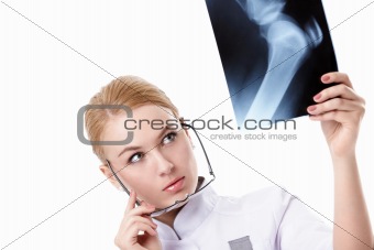 The doctor looks at x-ray