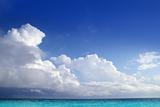 Caribbean aqua sea clouds in blue sky horizon