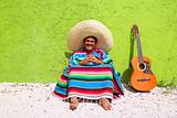 Mexican typical lazy topic man guitar poncho sit