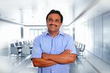 Indian latin businessman blue shirt in boardroom