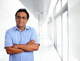indian latin businessman glasses blue shirt in office