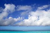 Cumulus clouds over caribbean turquoise sea