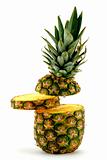 Pineapple and slice on white background