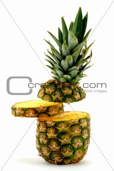 Pineapple and slice on white background