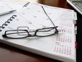 Monthly planner with glasses