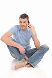 casual young man speaking on the mobile phone. isolated
