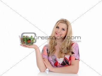 Pretty woman eating green vegetable salad. isolated on white 