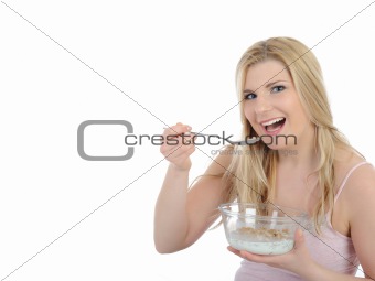 Pretty woman having muesli cereals for breakfast. isolated