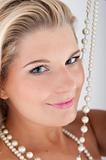 pretty woman with white teeth and pearls