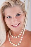 pretty woman with white teeth and pearls