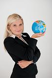 Beautiful business woman in a suit with globe figure