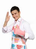 Young happy cook man in apron smiling and leathing. isolated