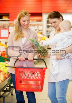 Two Friends Buying Groceries with Baby
