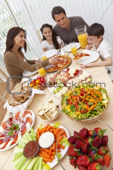 Parents Children Family Eating Pizza & Salad At Dining Table 