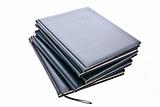 stack of notebooks on white background