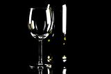 bottle of wine and wineglasses on black background