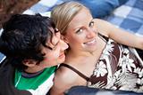 Young couple relaxing on picnic blanket