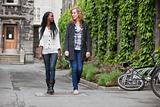 Young female friends having a chat while walking