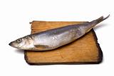 Herring on old wooden board
