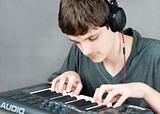 Focused Teen Plays Keyboard