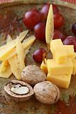 cheese plate with grapes and walnuts