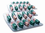 Tablets in capsules