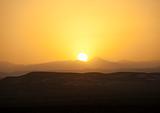 Desert sunset over the mountains