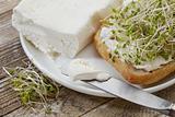 roll, cream cheese and broccoli sprouts