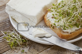 roll, cream cheese and broccoli sprouts