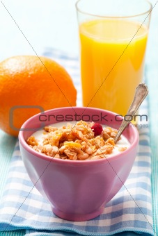 Breakfast with cereal, orange and orange juice