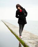 Young teen girl at outdoor near water.