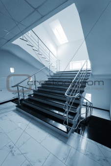 staircase with a steel handrail