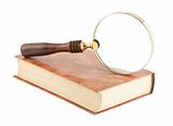 Magnifying glass on the book