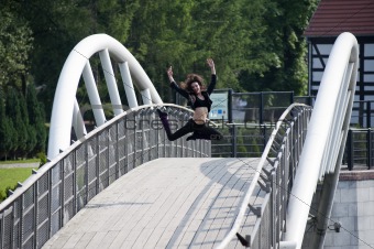 jumping dancer on bridge