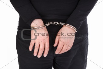 thief's hands in handcuffs