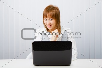 joyful surprise a girl with a laptop