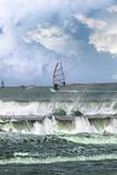 many surfers windsurfing in a storm