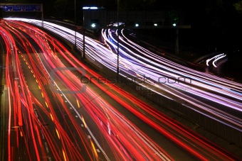 Night highway (Cars in a rush moving fast on a highway (speedway) 