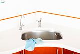 washbasin, blue rubber gloves and chrome faucets