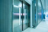  big steel door in office building with long corridor 