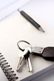 Diary, the handle and keys on a white background 