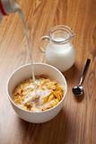 Bowl of breakfast cereal on wooden surface