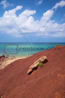 ocean and rock on red earth