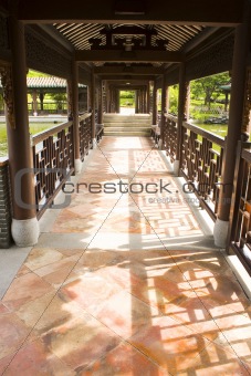 Traditional Chinese architecture, long corridor in outdoor park 