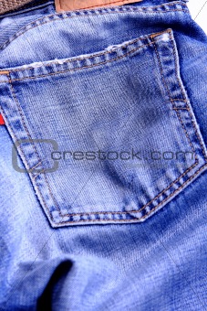 Fragment of blue modern jeans with pocket, can be used as a background. 
