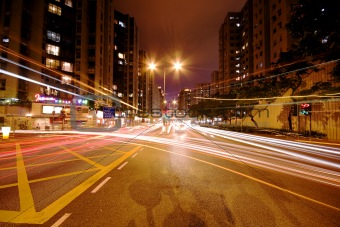 Modern Urban City with Freeway Traffic at Night